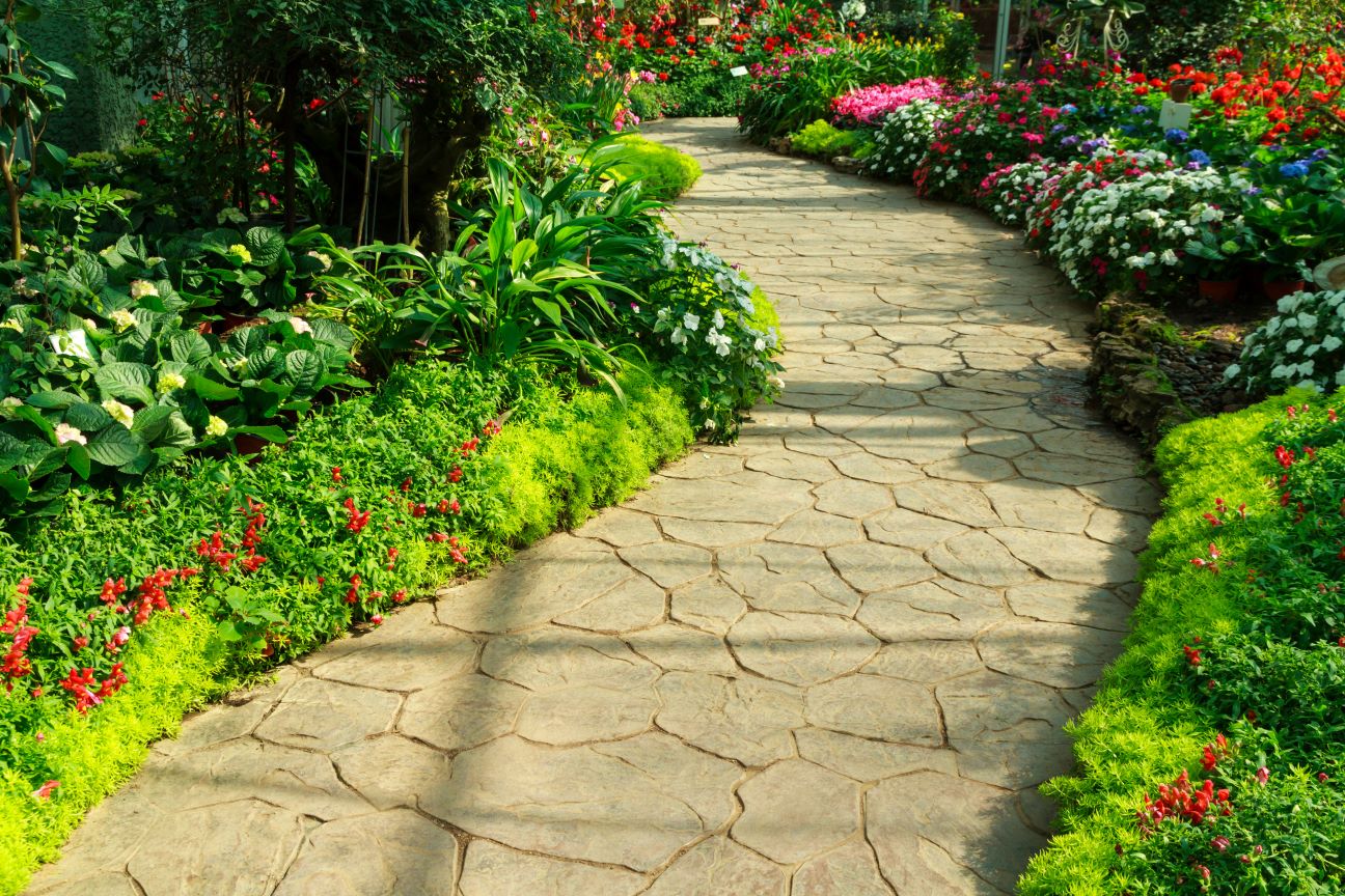 A path made of pavers in a green, vibrant garden