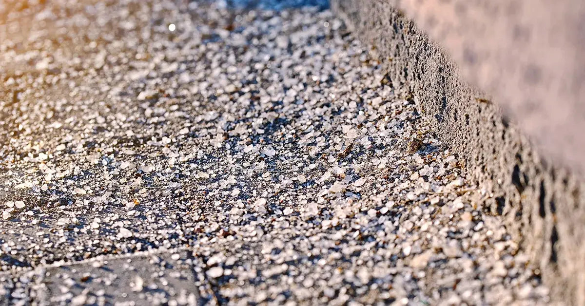 Ice melts sits on a walkway